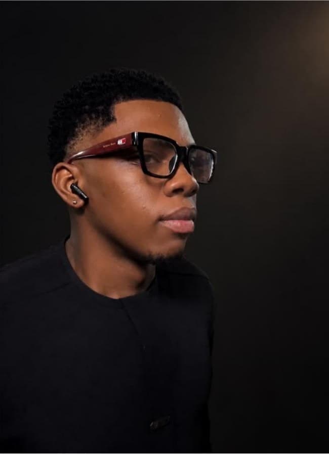 Ifeanyi Onyekwelu in profile against a dark background